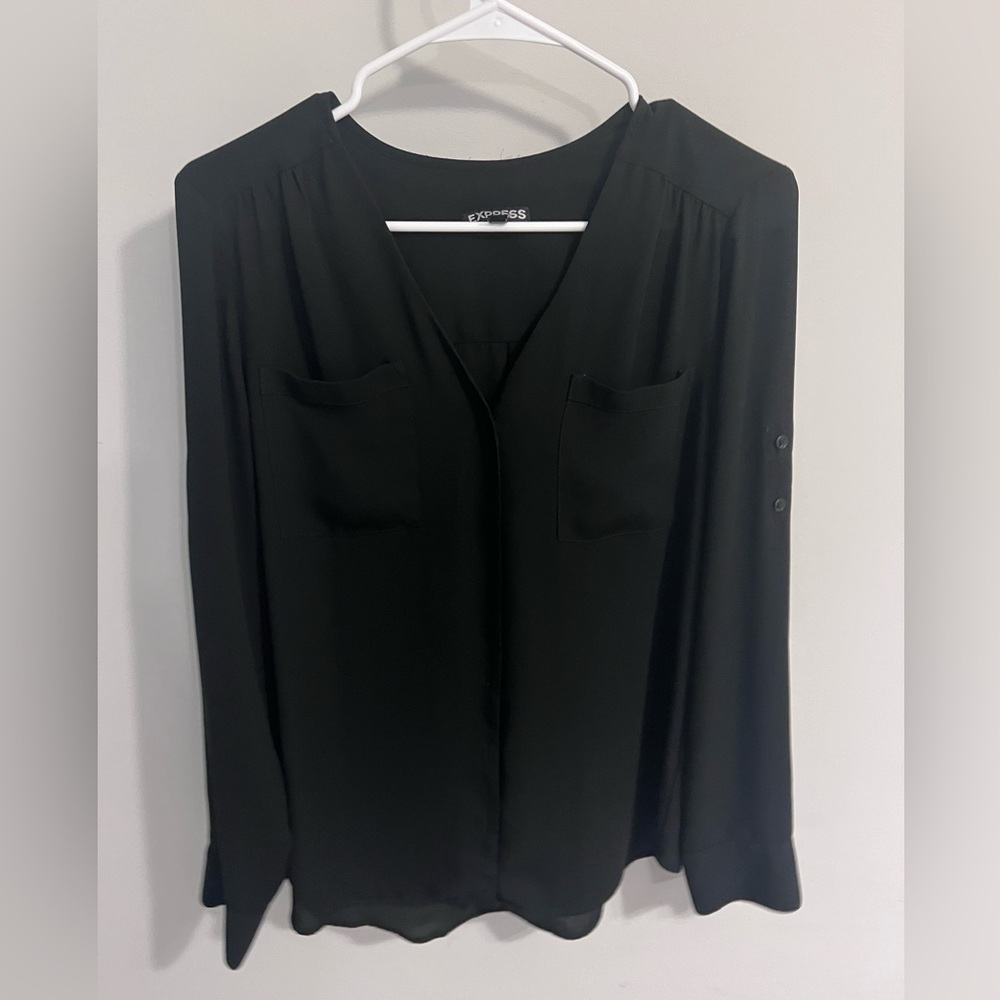 Black express top. Buttons on sleeves to roll up
